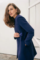 Side view of The Sisters Collection Olivia ink blue tailored occasion coat