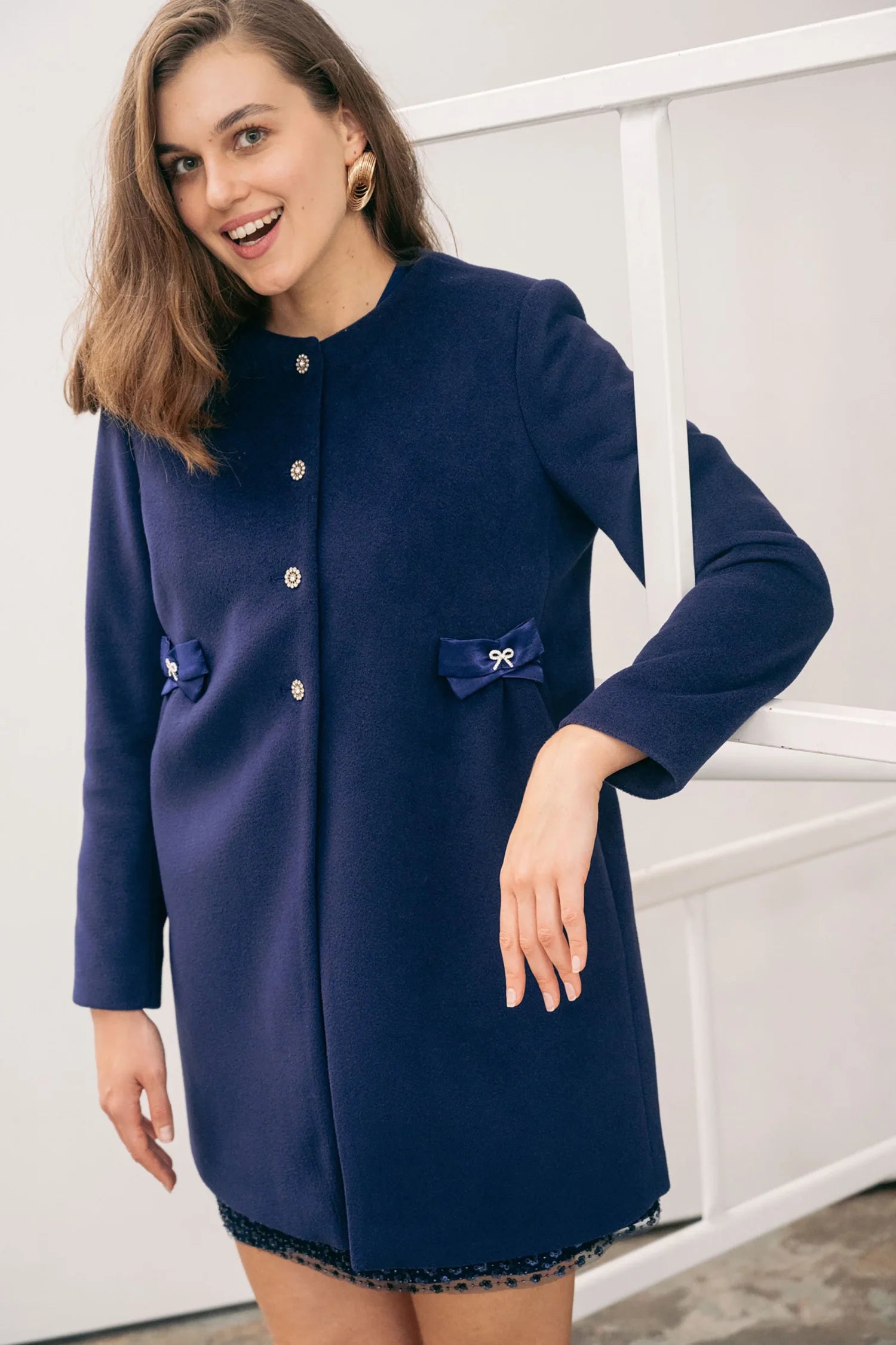 The Sisters Collection Olivia ink blue bow pocket occasion coat front view