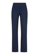 Full length Stehmann Editta navy trousers on model with trainers