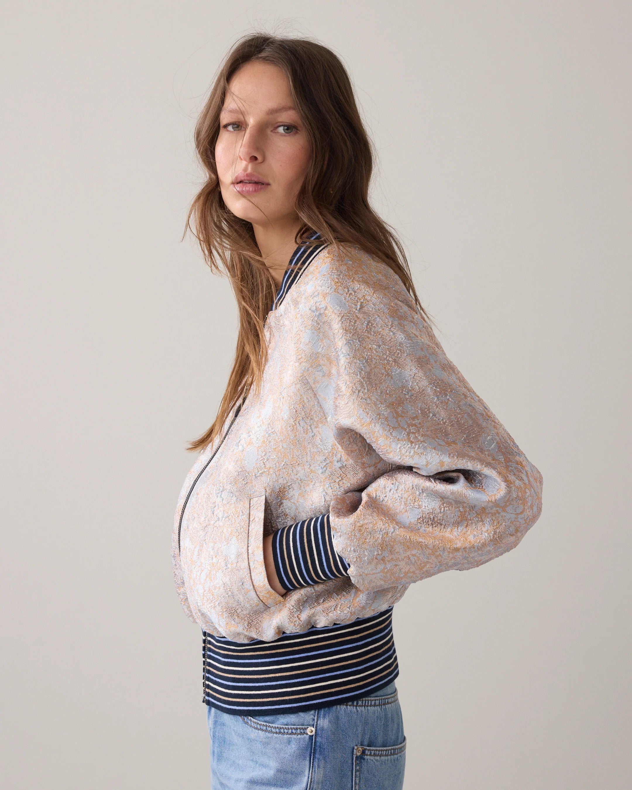 Summum jacquard bomber jacket side view showing striped hem detail