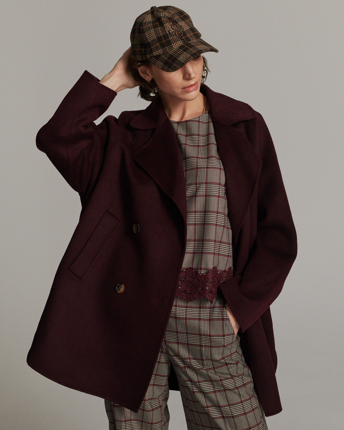 Summum burgundy wool blend coat styled with checked outfit