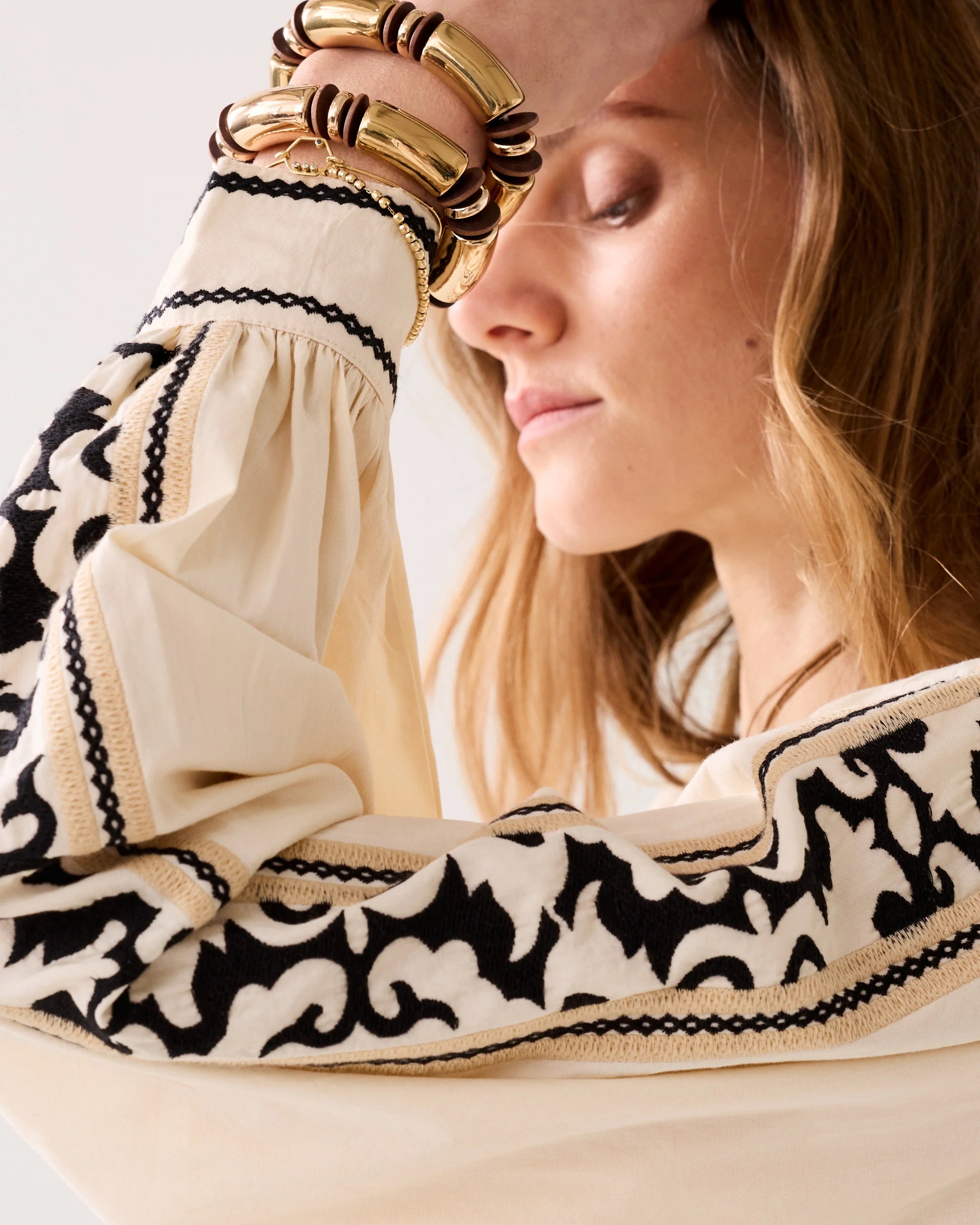 Summum cream blouse outfit styling with trousers embroidered detail