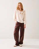 Summum cream ruffle blouse asymmetric shoulder detail front view