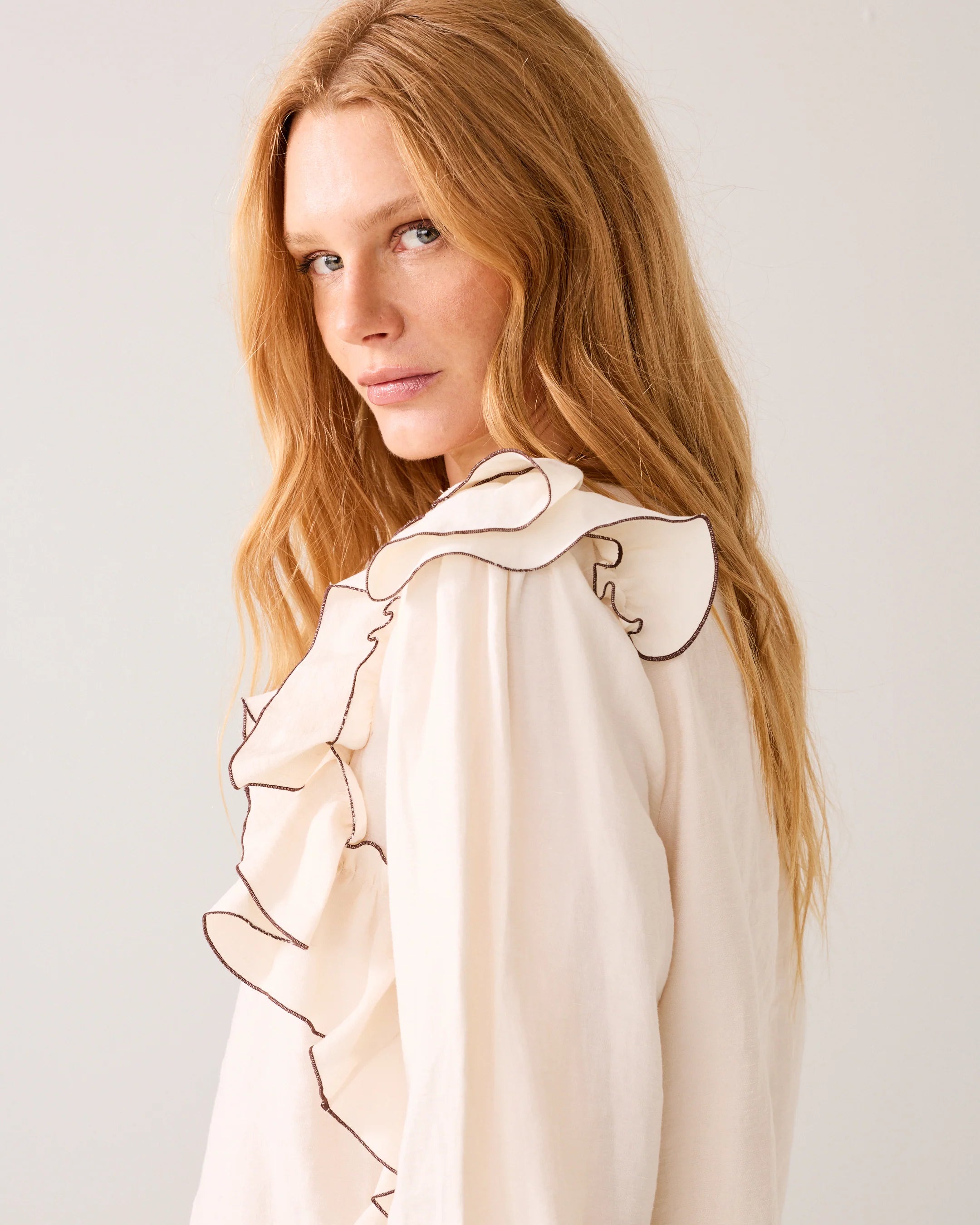 Summum cream blouse side view ruffle sleeve detail