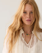 Summum cream embellished blouse – neckline and satin pleat detail