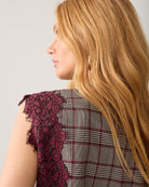 Close-up of Summum floral lace trim and check fabric