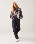 Women’s Summum floral print bow blouse styled with dark trousers