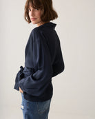  Summum navy V-neck top – side model view showing wide balloon sleeve