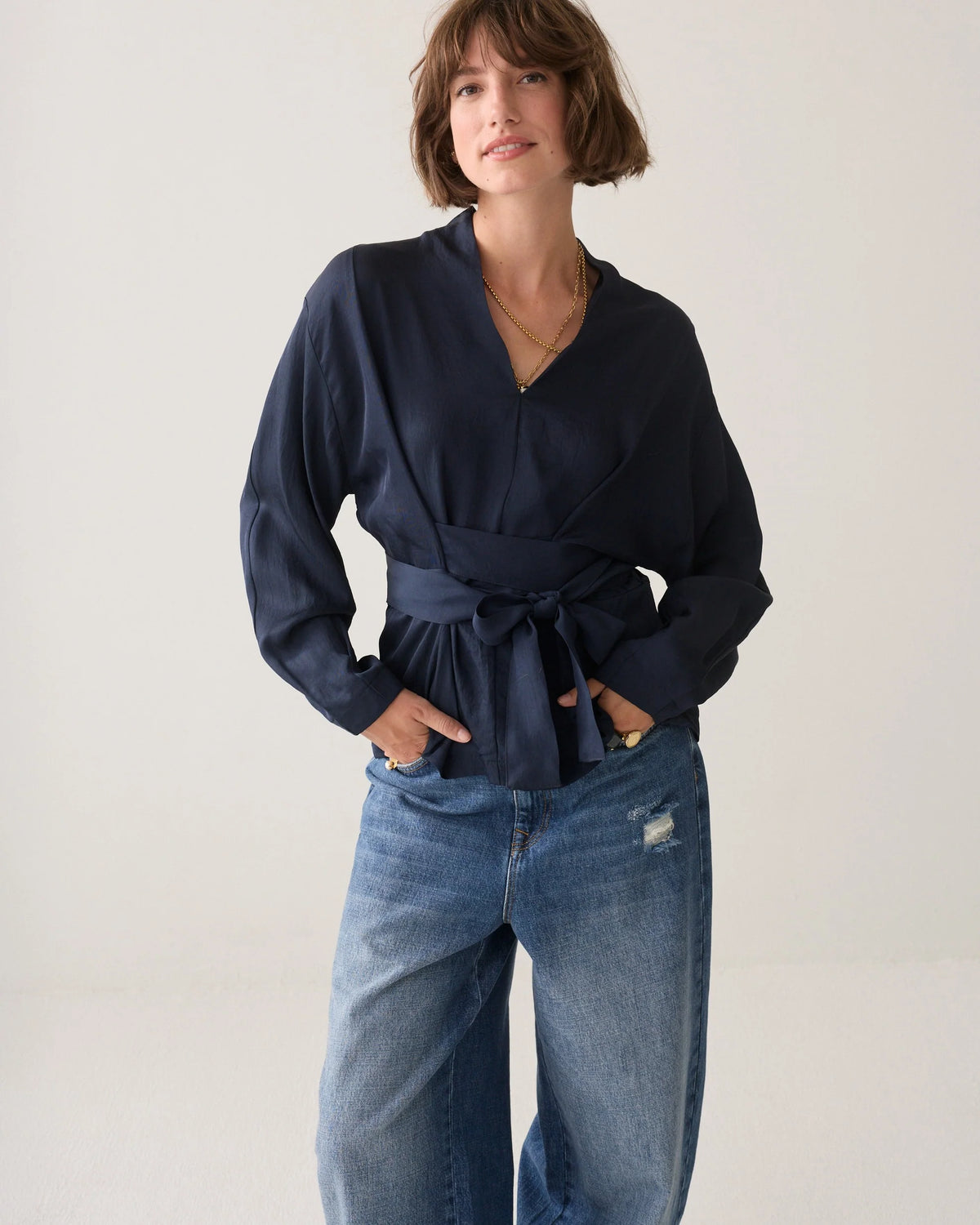 Summum navy V-neck wrap top – front model view