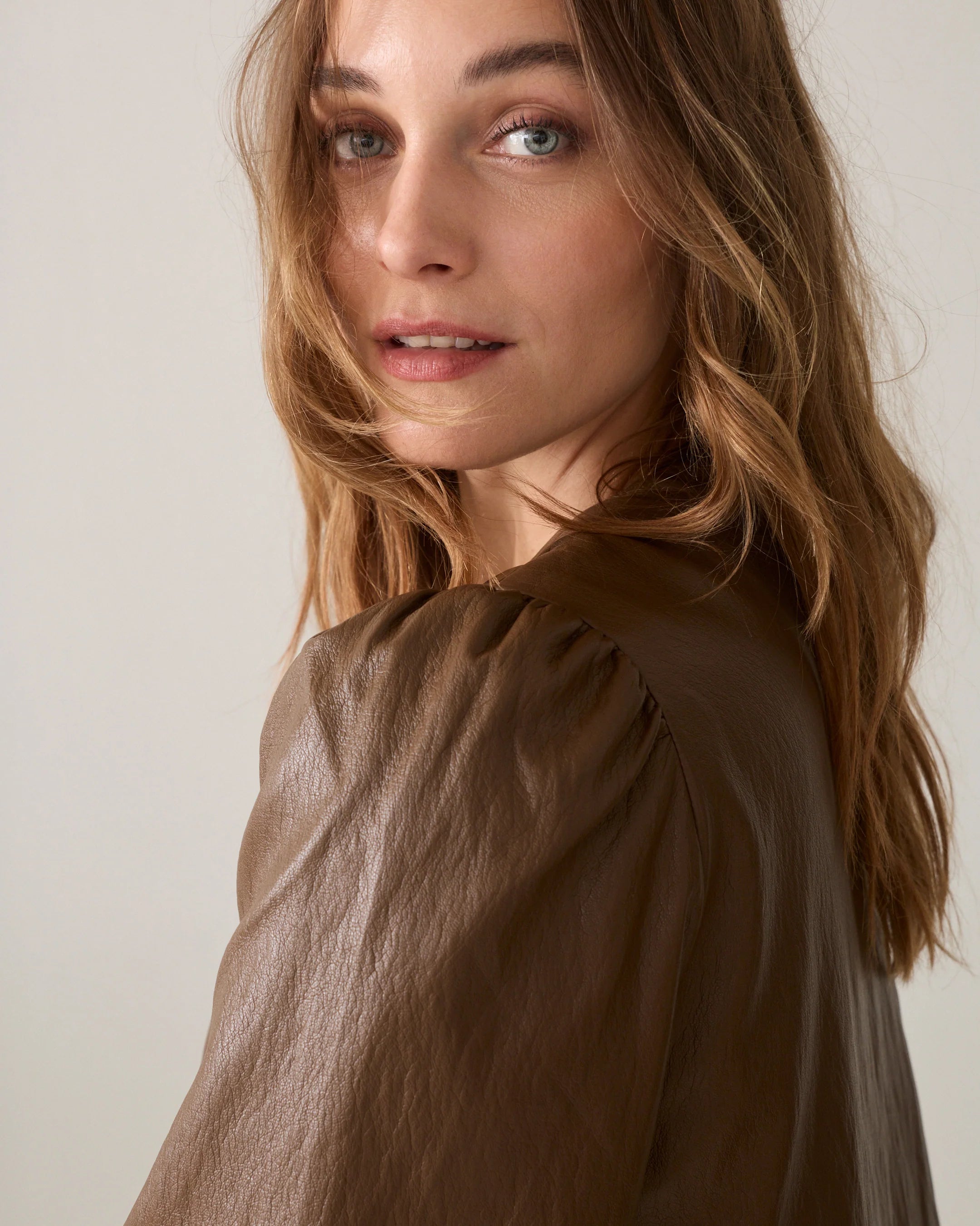 Summum tan brown leather-look jacket showing gathered puff sleeve and shoulder detail – close-up