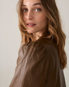 Summum tan brown leather-look jacket showing gathered puff sleeve and shoulder detail – close-up