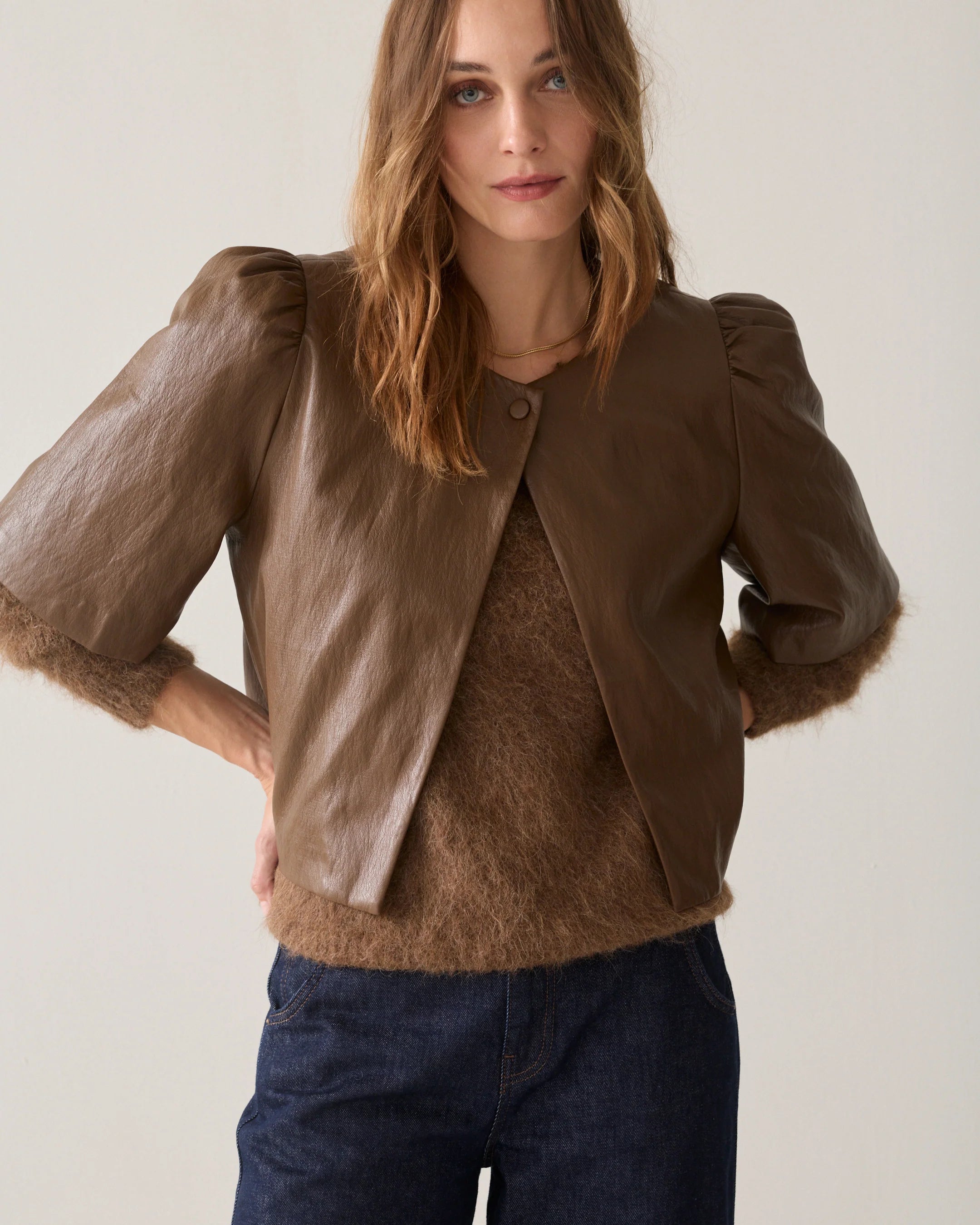 Summum tan brown faux leather puff sleeve jacket worn over a matching brown top – front model view