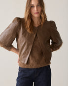 Summum tan brown faux leather puff sleeve jacket worn over a matching brown top – front model view