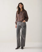 Summum brown and lilac floral cropped blouse styled with grey wide-leg trousers – full model view