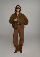 Summum Misty Flower cropped blouse layered under brown jacket with matching trousers