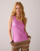 Model wearing Summum pink ribbed tank top with foil shimmer