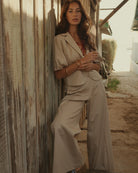 Summum cream tailored trousers styled with neutral top