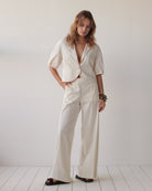 Summum cream wide trousers styled with matching jacket