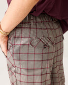 Close-up of Summum check trousers pocket detail