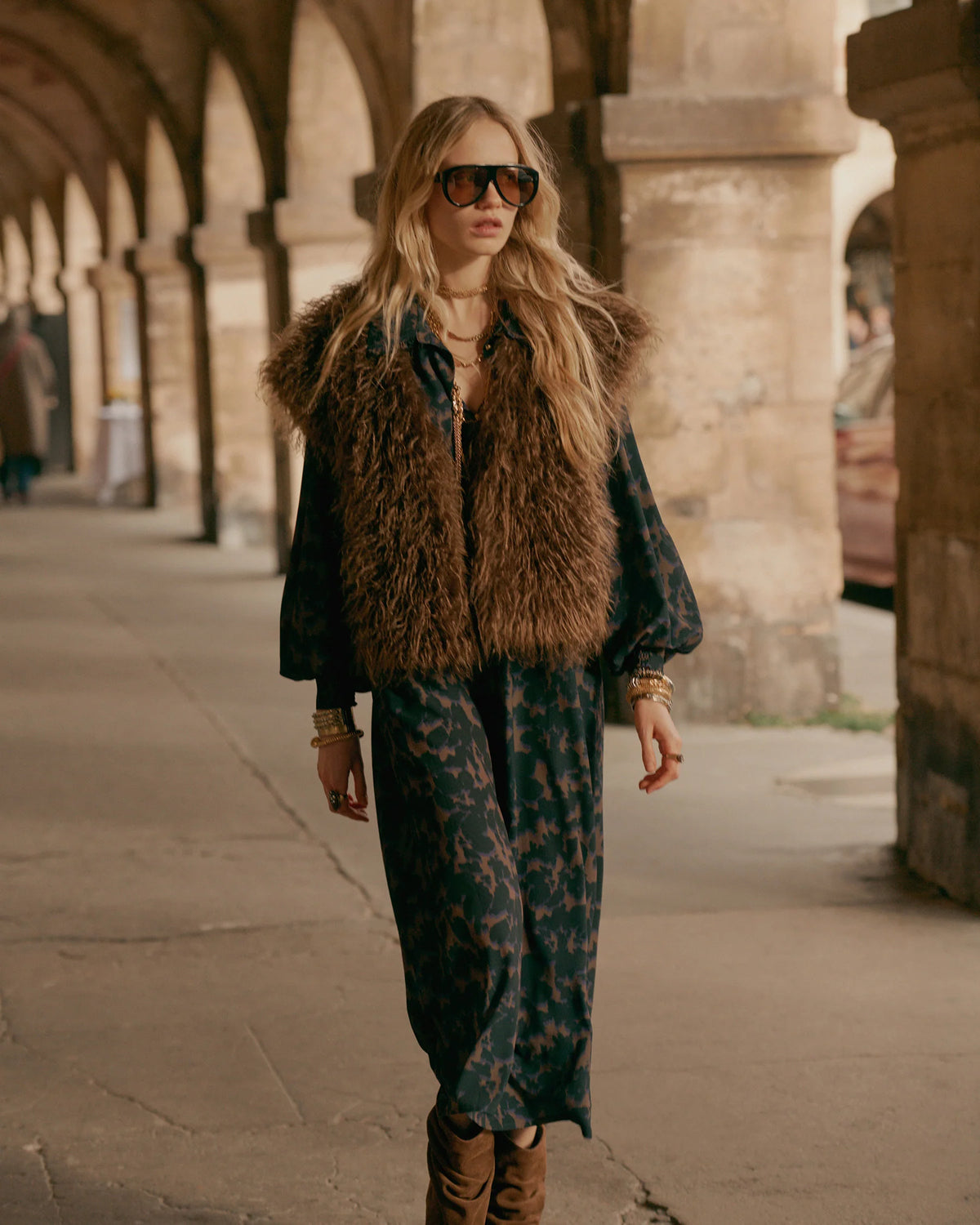 Summum camouflage print midi dress layered with a brown faux-fur gilet – outdoor lifestyle view