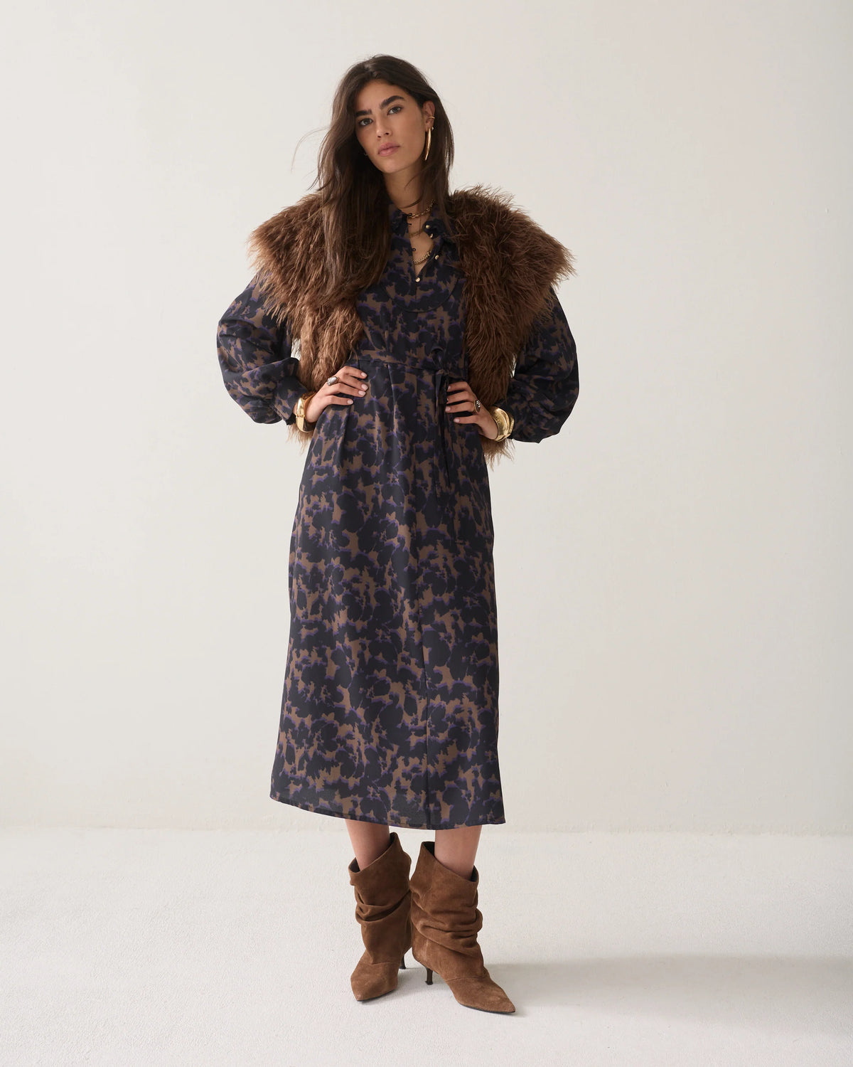 Summum black camouflage midi dress styled with brown faux-fur gilet and boots – full model view