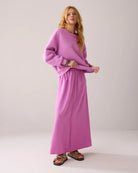 Full front view of Summum flowing Tencel skirt styled with matching top and sandals