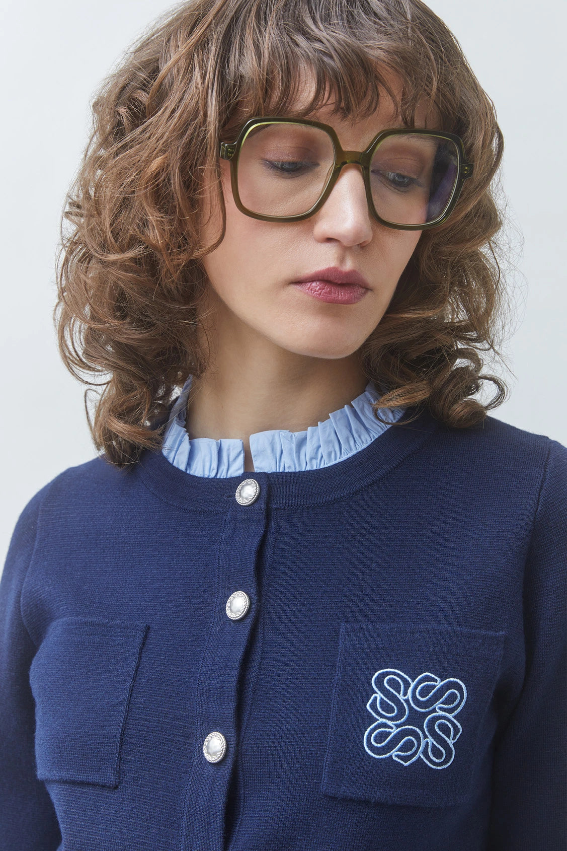 Suncoo Geola navy cardigan close-up with removable blue collar and silver buttons