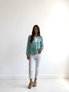 Girls Curiosity Portia cactus print V-neck blouse in green and cream with contrasting neckline trim