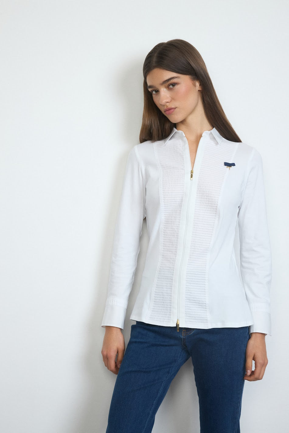 Front view of white Tinta Amaia shirt with pintuck pleats and zip closure