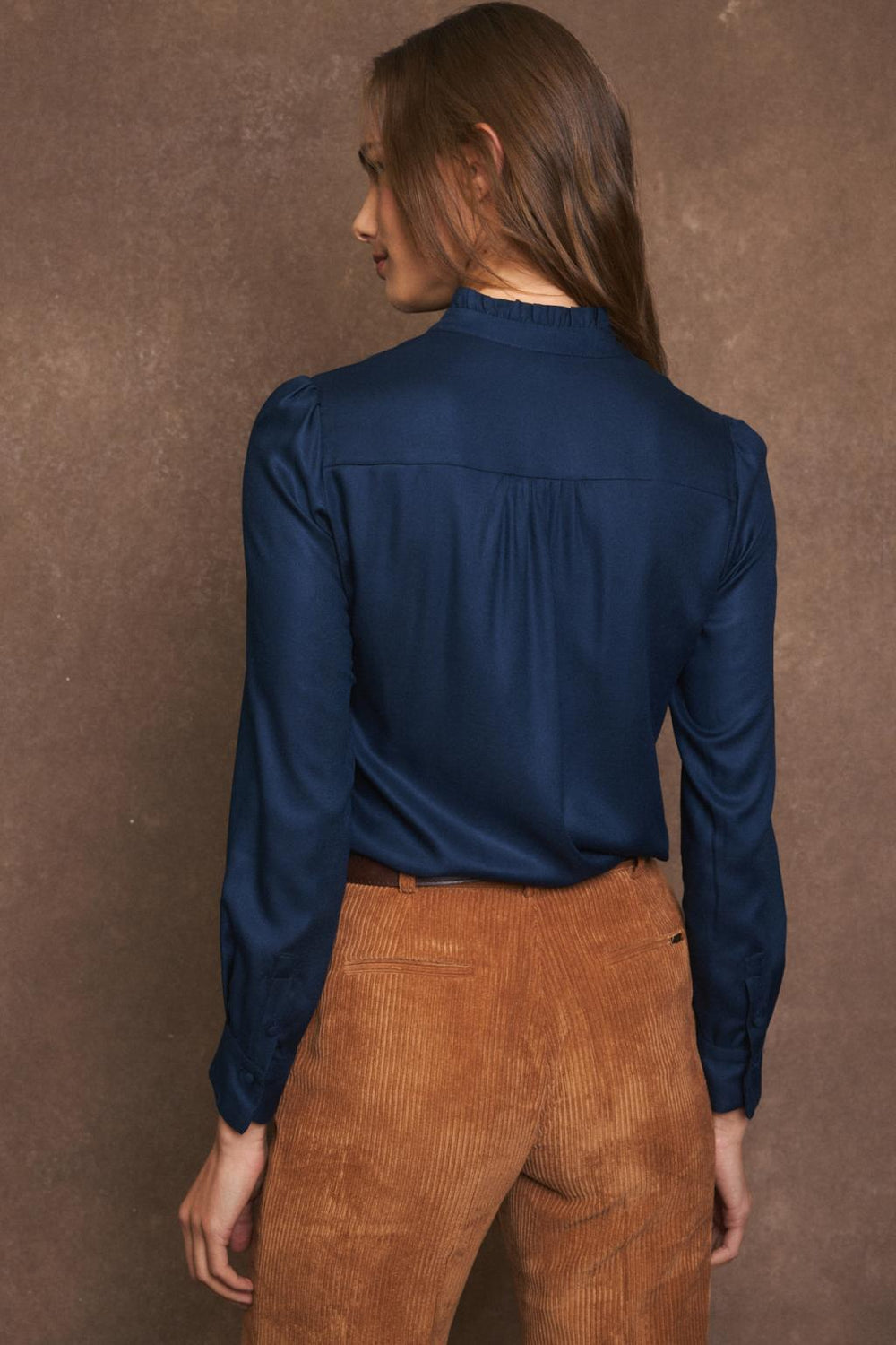 Back view of shirt showing gathered shoulder panel and neat collar
