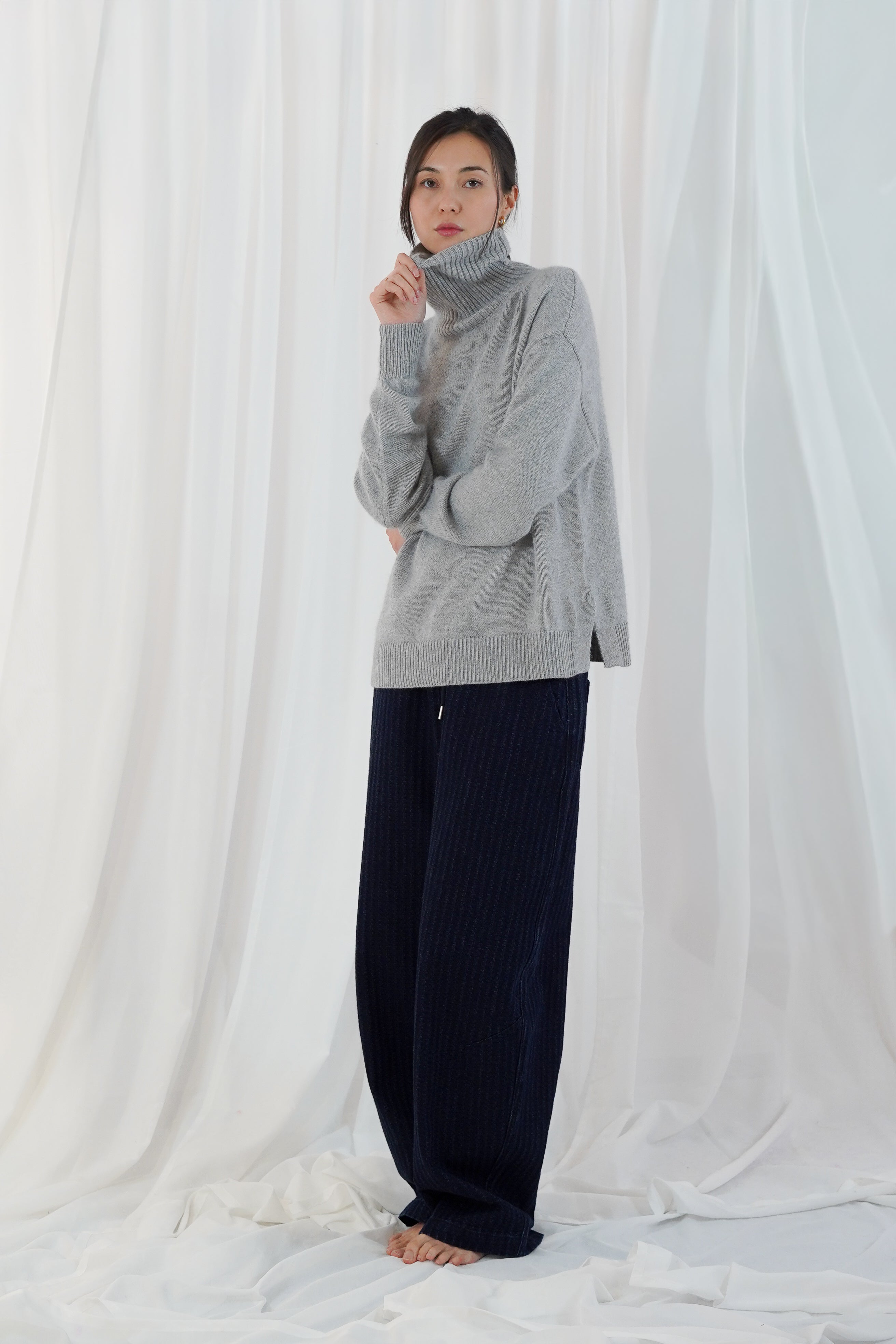 Twins Greeley grey relaxed roll neck jumper shown from the side