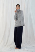 Twins Greeley grey relaxed roll neck jumper shown from the side