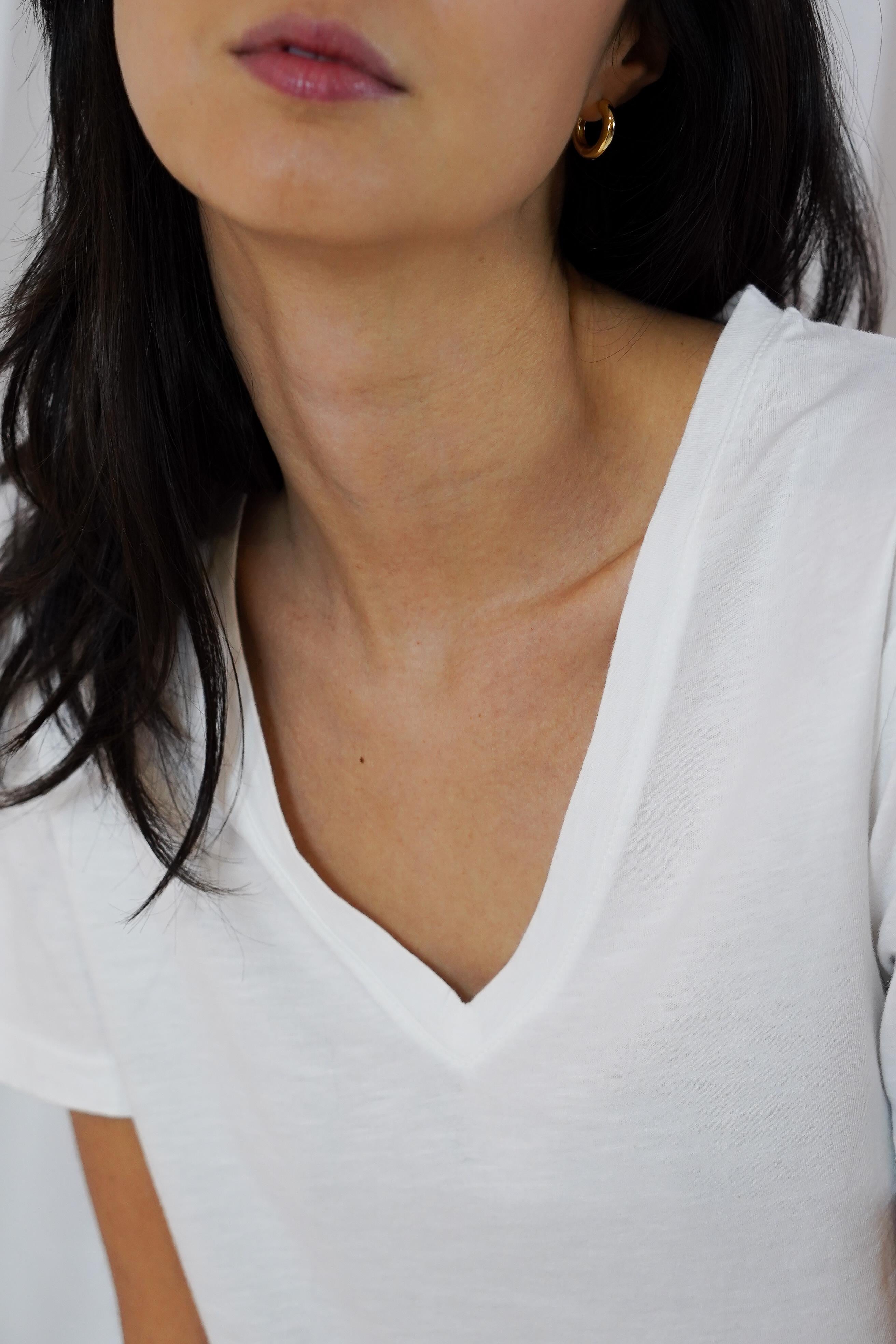 Close-up of Twins Kings white T-shirt showing the V-neckline