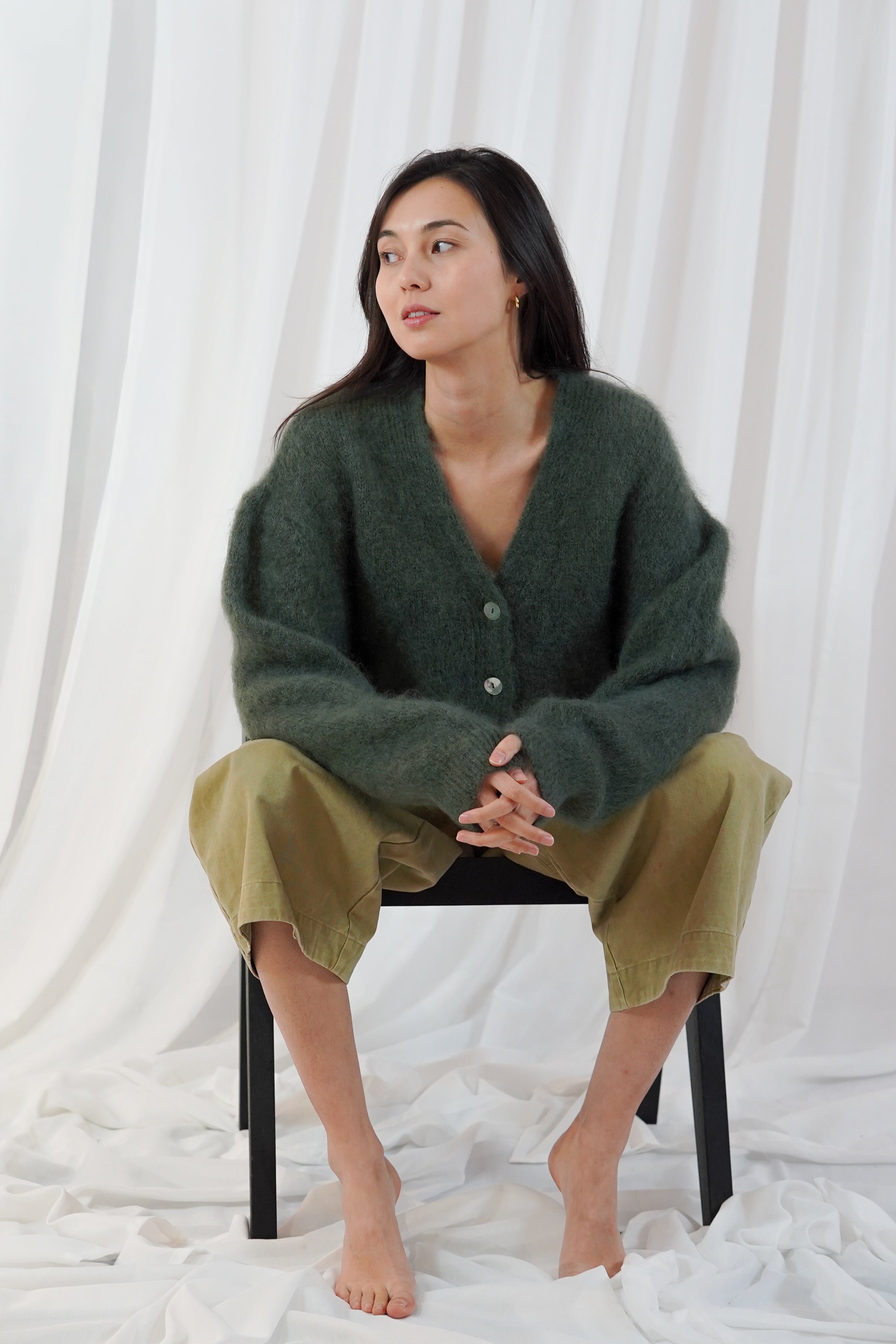 Twins Malia forest green relaxed mohair cardigan styled with olive trousers
