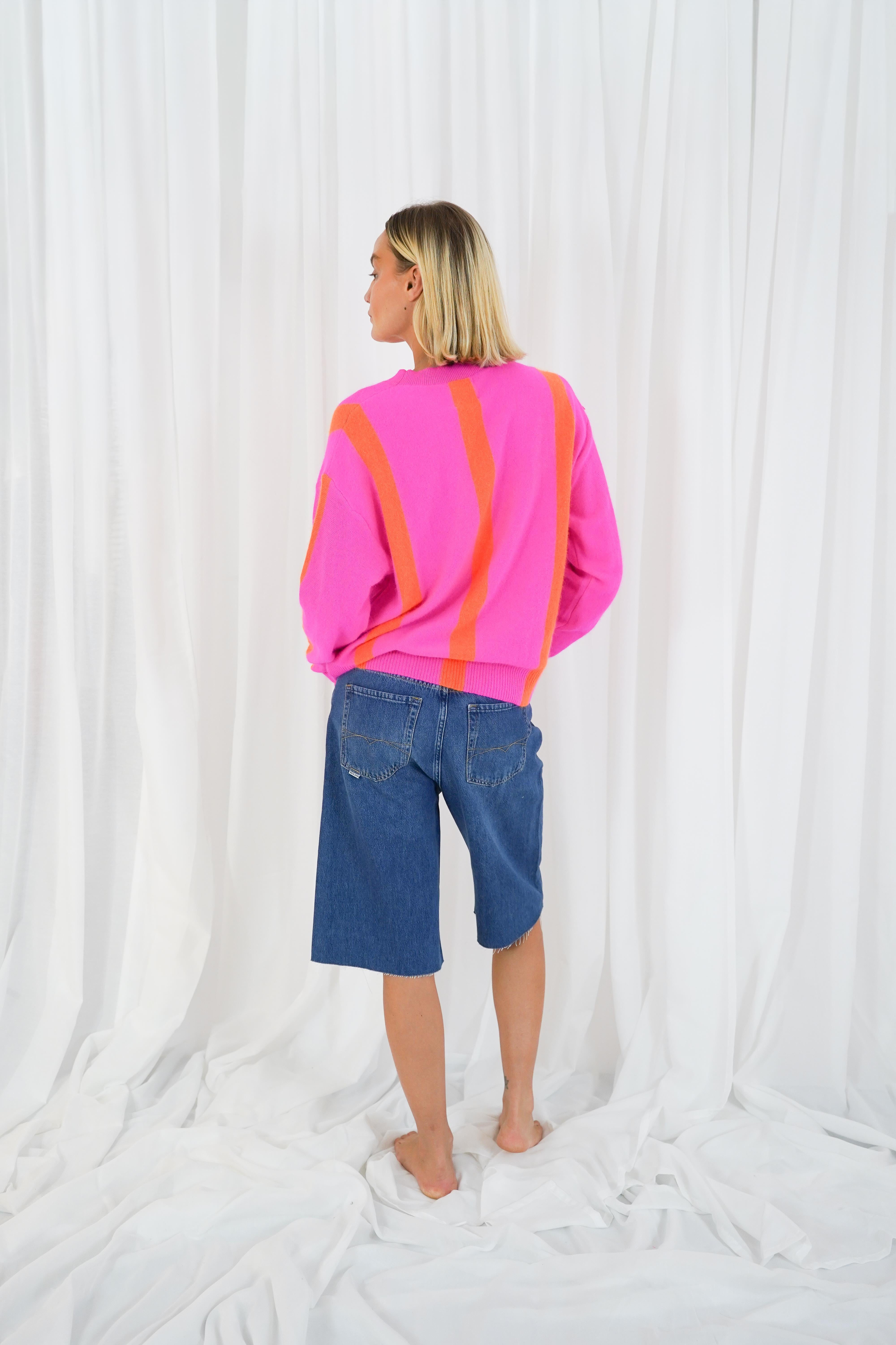 Back view of Twins Reno neon pink and orange striped knitted jumper