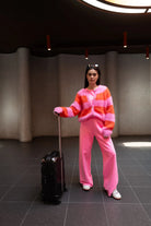 Twins Timea striped cardigan styled with pink trousers