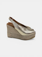 Viguera gold peep toe wedge sandals platform sole angled front view