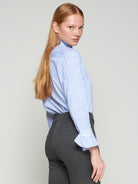 Women’s pinstripe shirt by Vilagallo featuring ruffled collar and cuff detail.