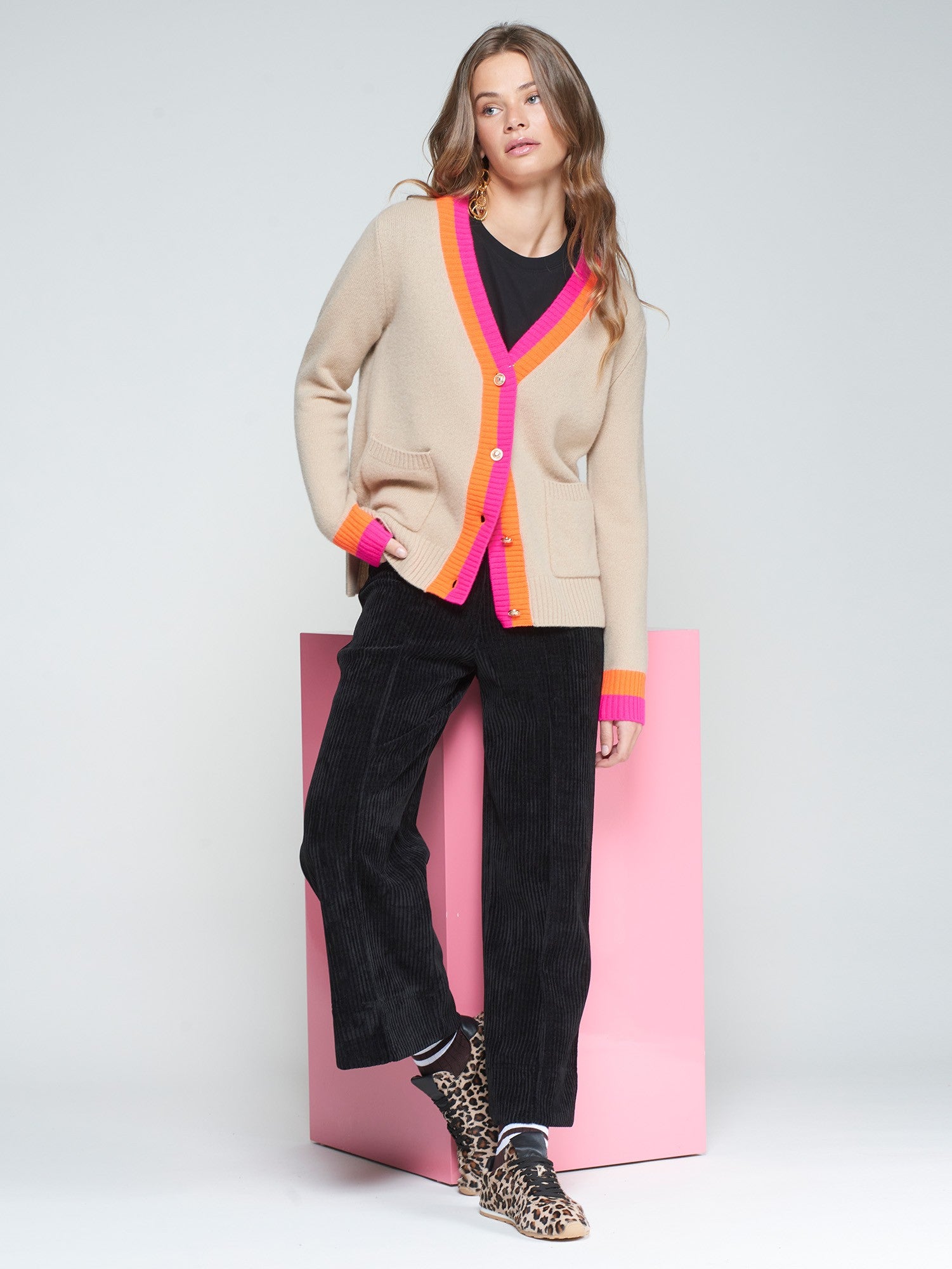 Front view of Vilagallo Alina beige wool cardigan with pink and orange trim