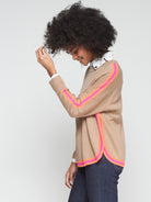 Sport-luxe camel jumper with bright stripe trim by Vilagallo.