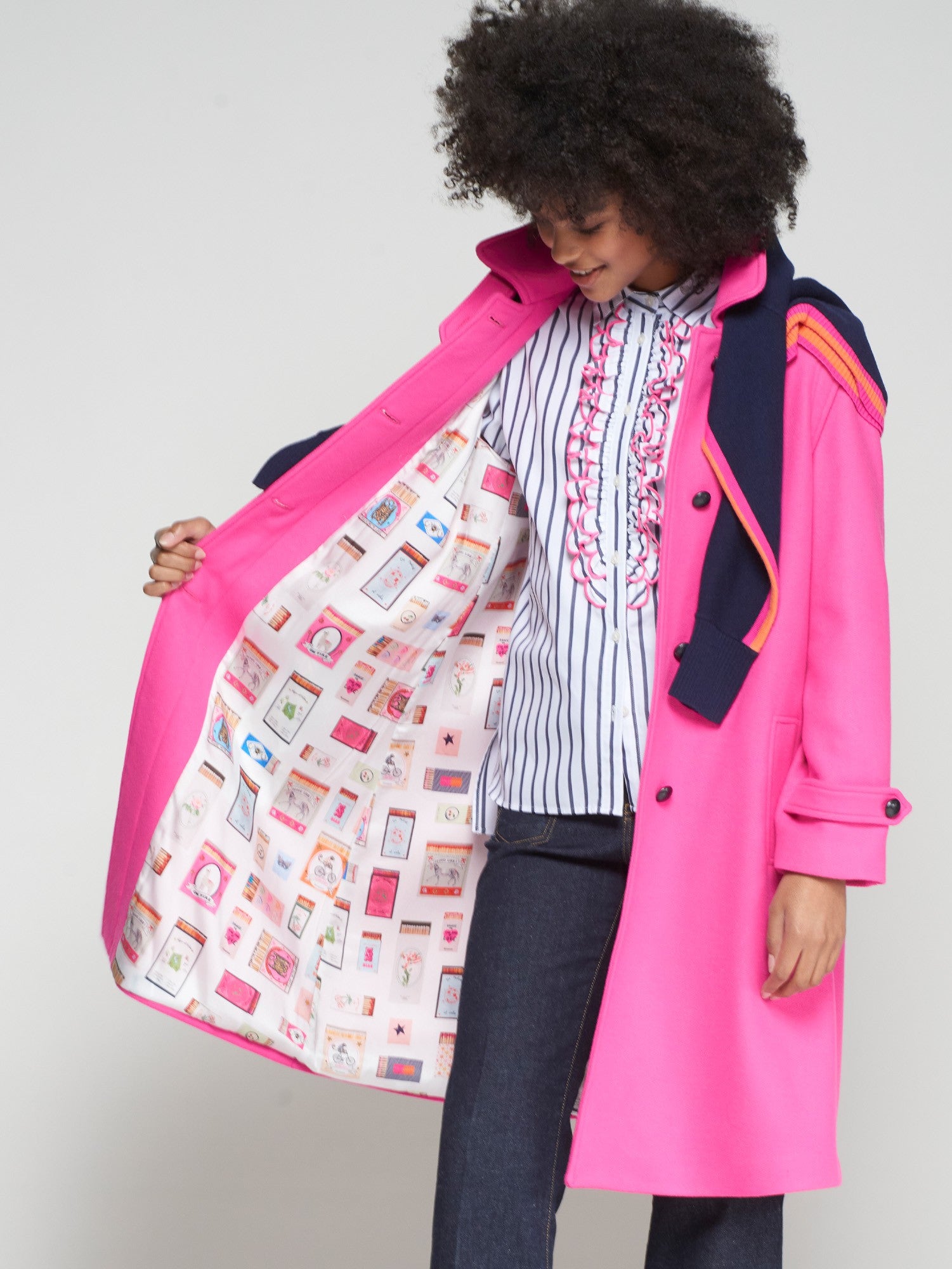 Colourful illustrated lining inside Vilagallo pink trench style coat
