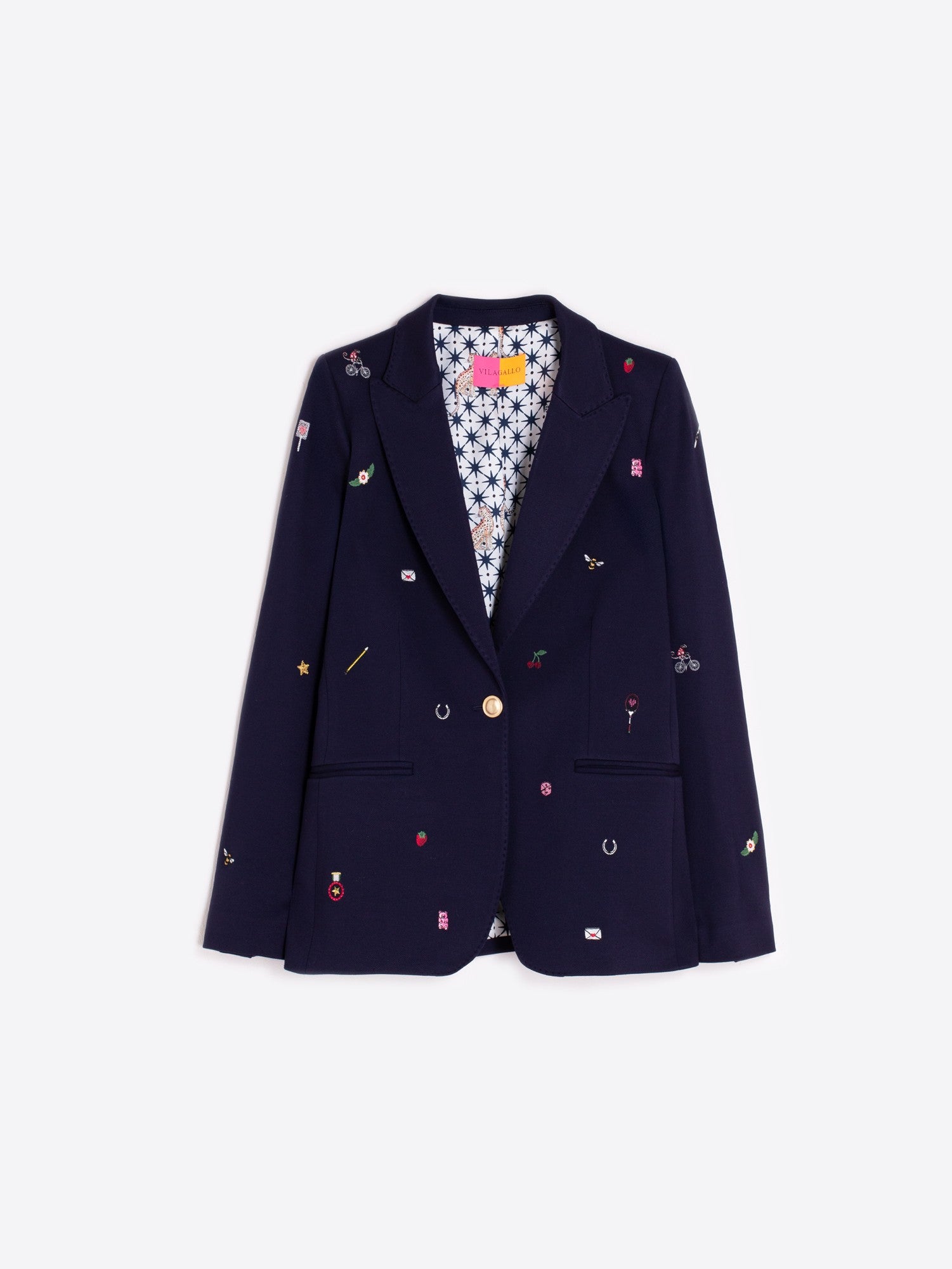 Close-up of gold-tone buttons and colourful embroidery on Vilagallo navy blazer