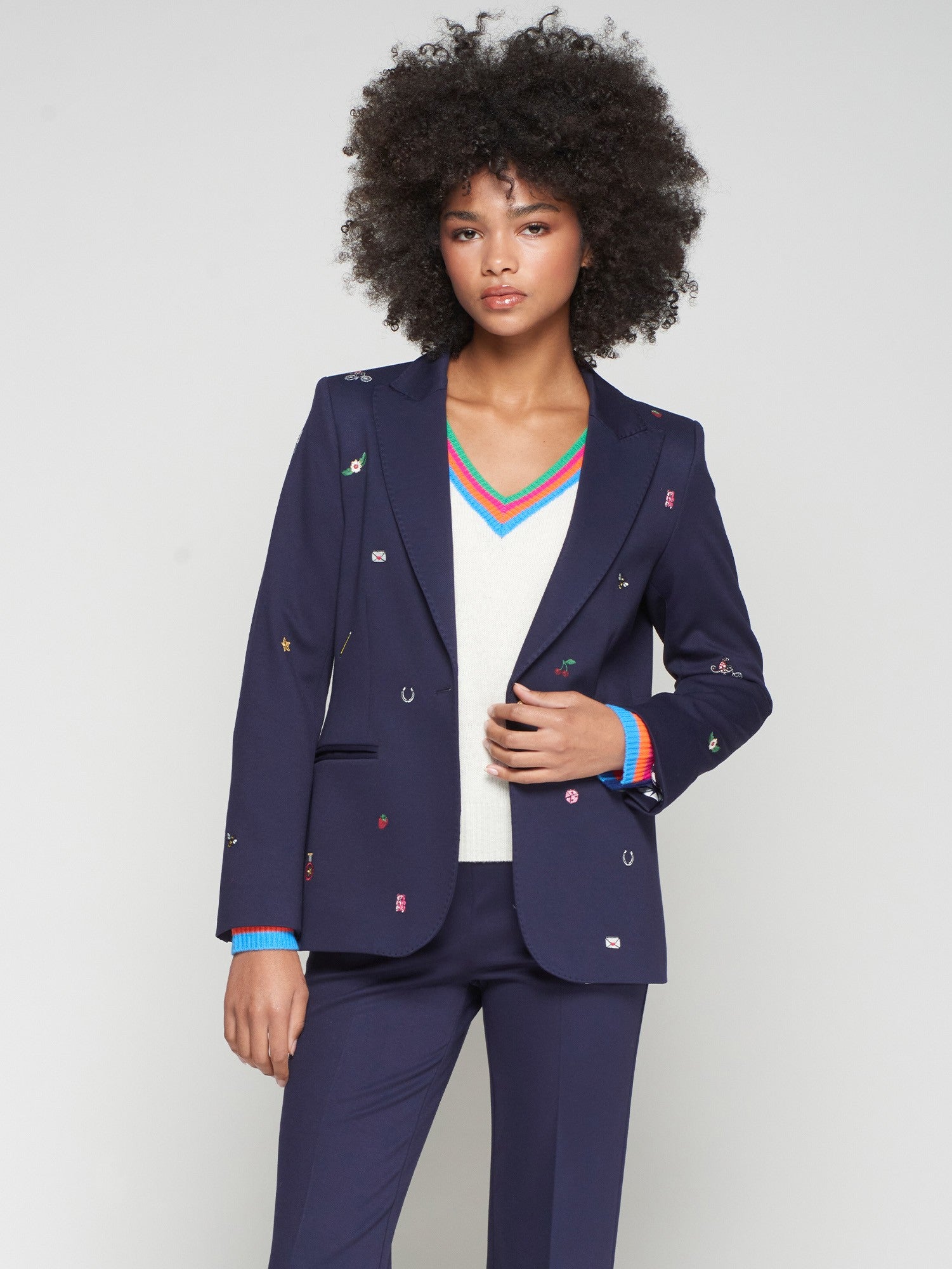 Front view of Vilagallo navy blazer with embroidered cherries, horseshoes and flowers