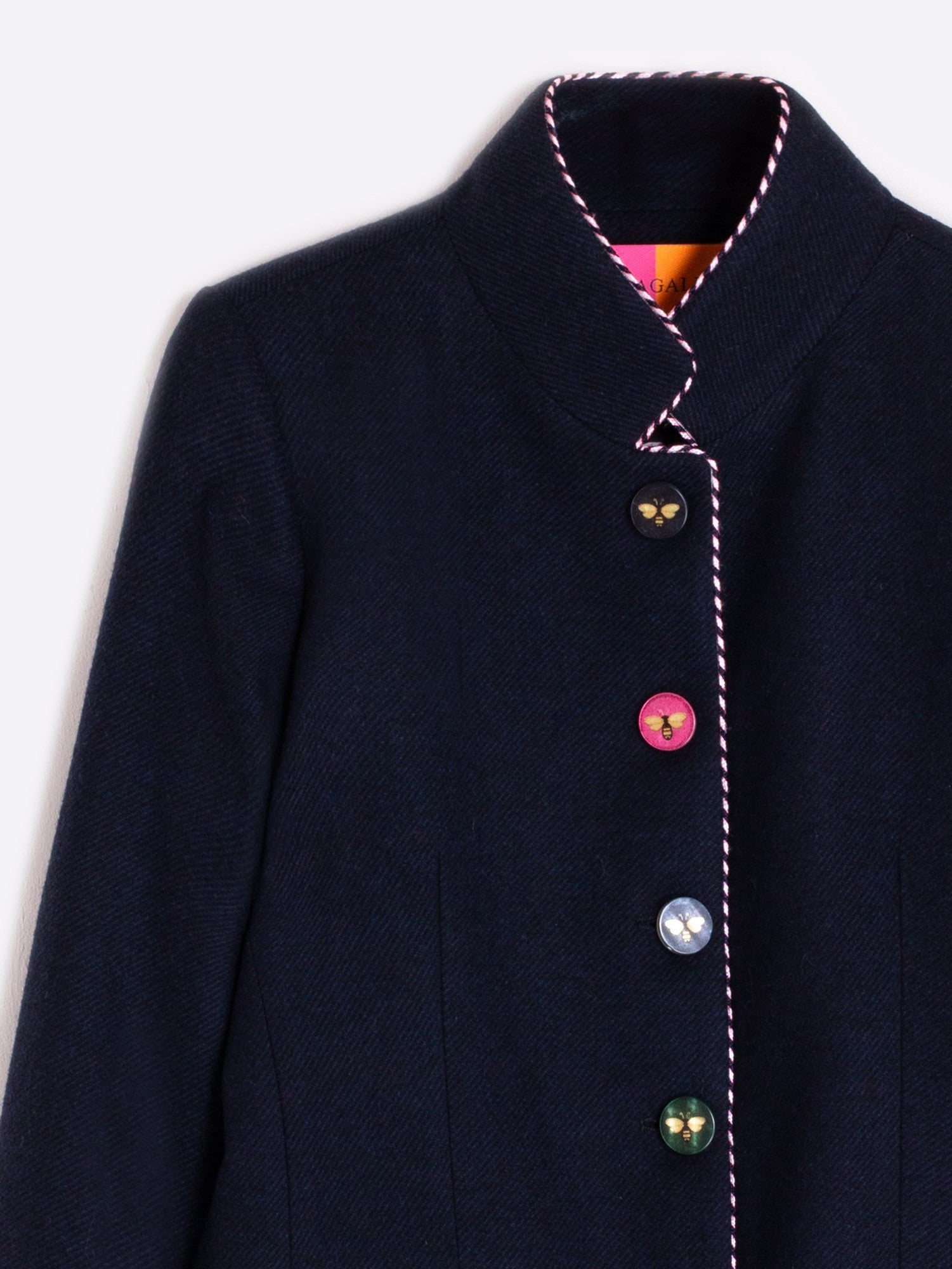 Women’s short tailored navy jacket with stand collar and bee buttons by VILAGALLO.