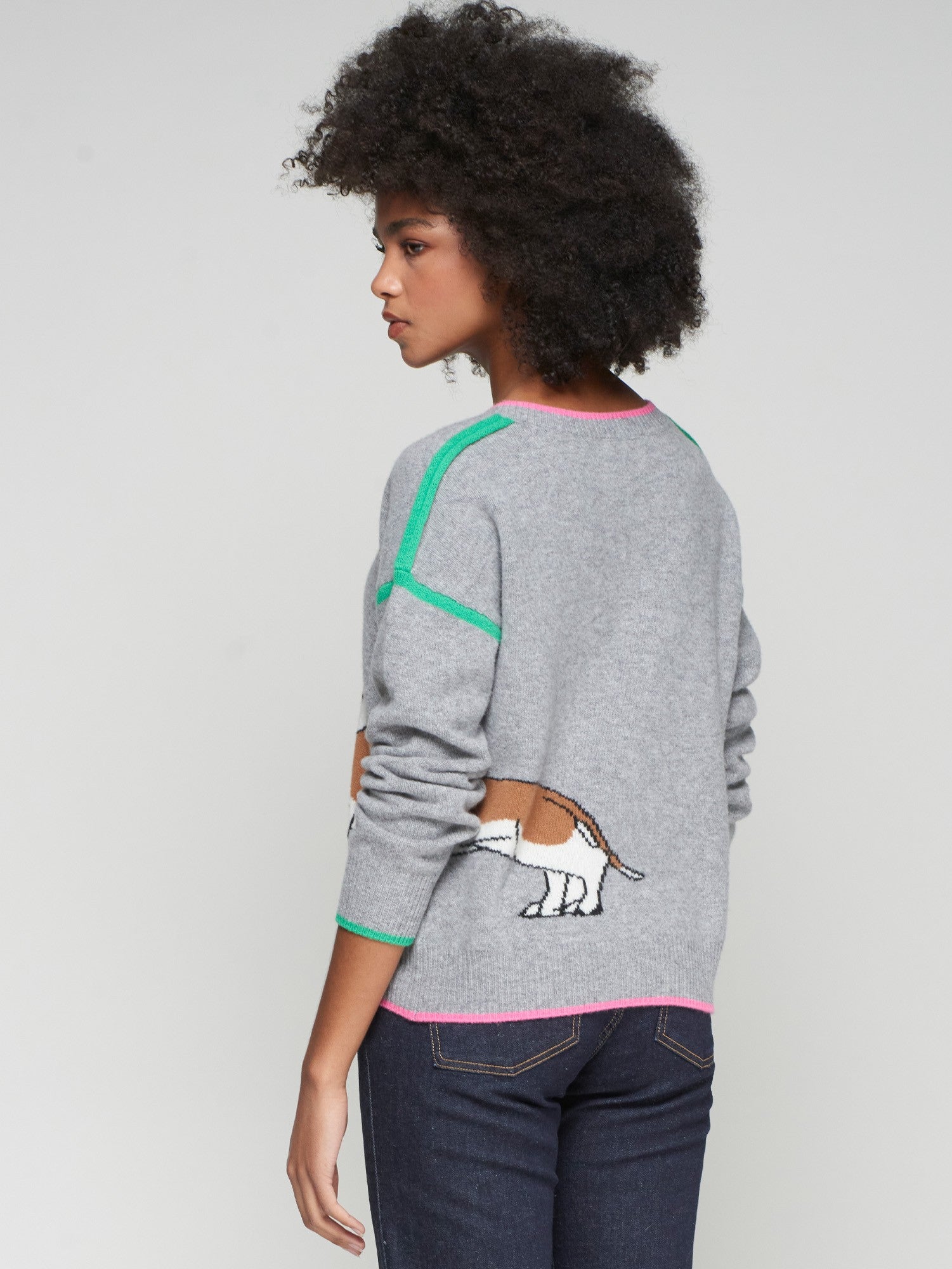 Women’s grey wool dachshund sweater by Vilagallo with pink trim and green stripes.