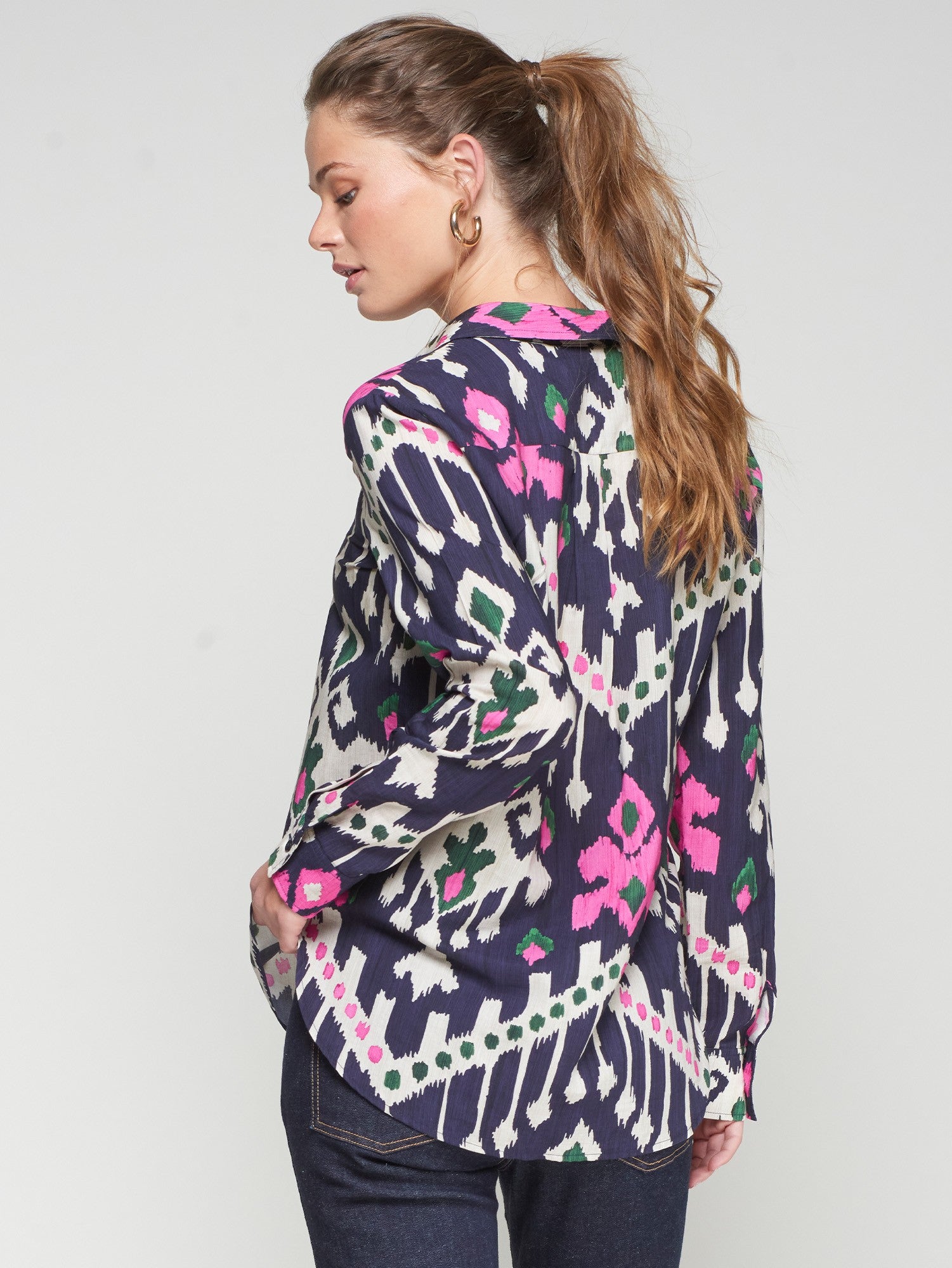 Back view of Vilagallo patterned blouse in navy with vibrant print
