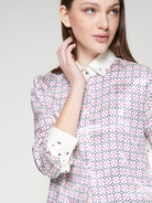 Close-up of Vilagallo shirt collar with star and moon embroidery
