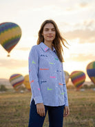 Vilagallo blue word embroidery striped shirt styled outdoors with jeans