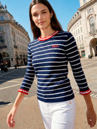 Vilagallo navy ribbed striped jumper with red trim styled with white trousers