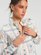 Vilagallo printed shirt close-up showing framed stars guitars and colourful motifs